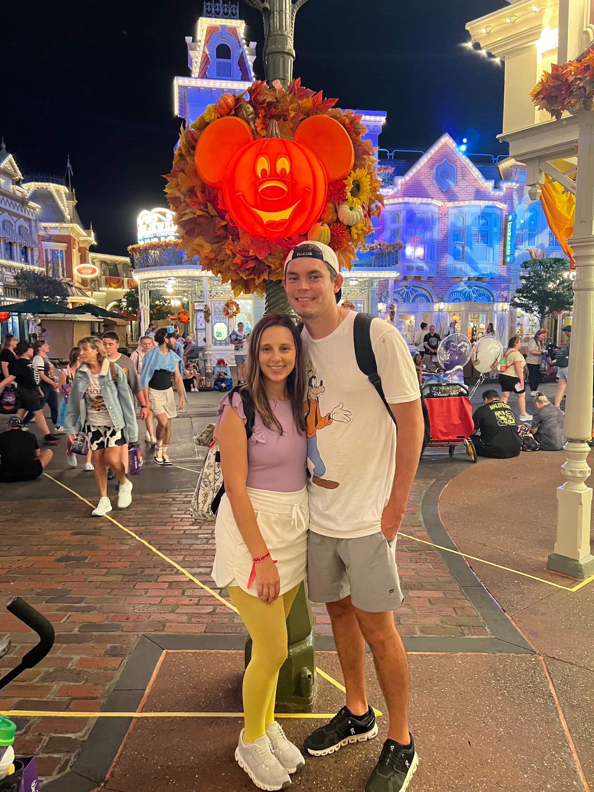 Couple on Main Street decorated for Halloween at night