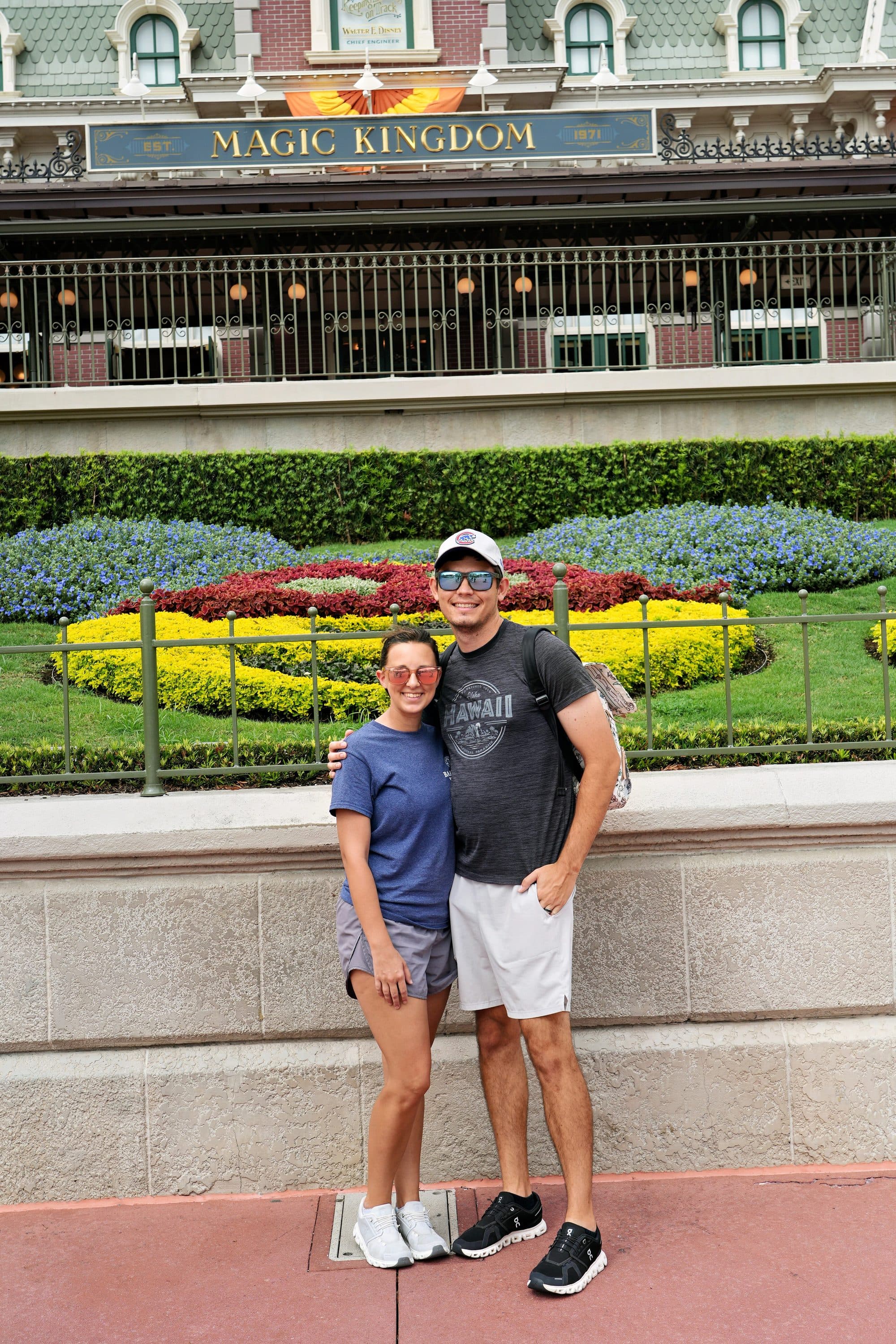 Couple standing in front of the Magic Kingdom train station entrance