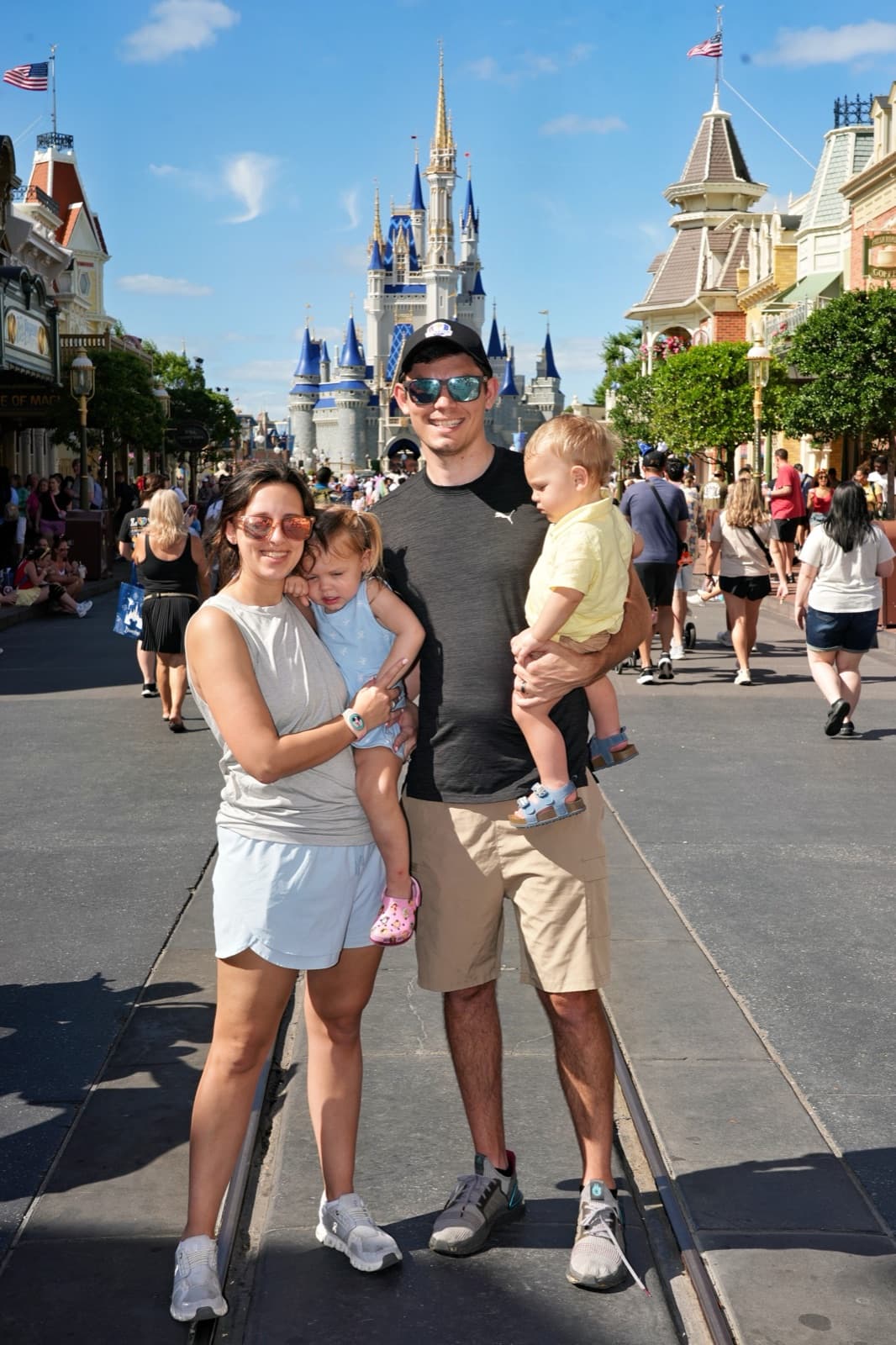 Brooke and her family at Magic Kingdom in front of Cinderella Castle